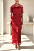 Vestido midi Elowyn de malla con flecos escalonados de patchwork, cuello redondo y manga capa