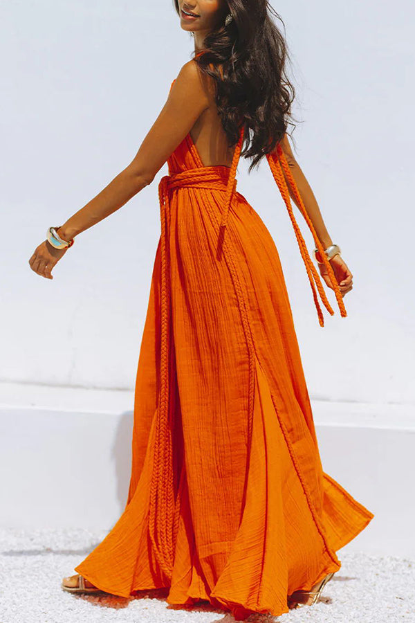 Vestido largo de mezcla de lino tipo pareo con trenzas drapeadas, escote en V profundo, cuello halter y espalda descubierta