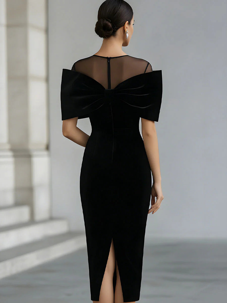 Regina ❘ Vestido midi de terciopelo negro con lazo statement