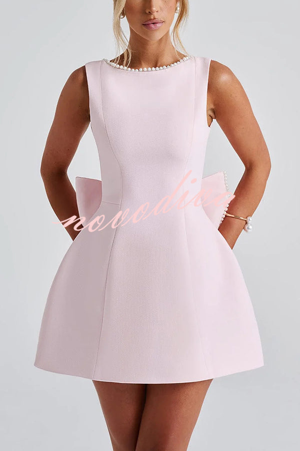 Minivestido ajustado con gran lazo adornado con perlas