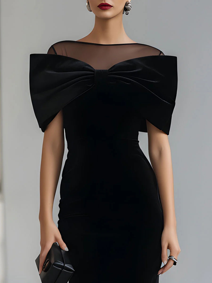 Regina ❘ Vestido midi de terciopelo negro con lazo statement