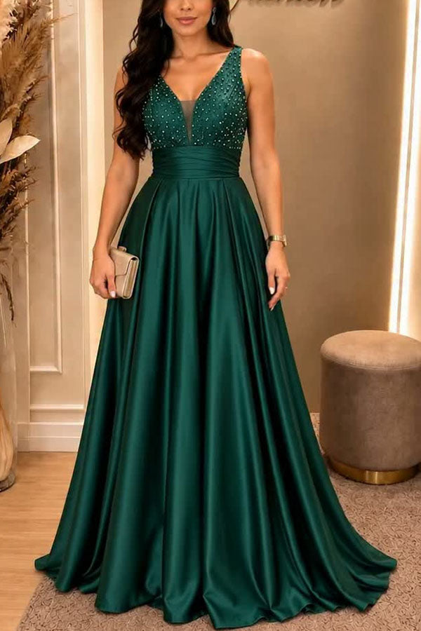 Vestido largo de gala Gran Baile de satén con detalles de pedrería, escote de pico y bajo plisado