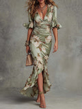Anna - Vestido largo asimétrico en satén verde con escote en V, mangas abullonadas acampanadas y estampado floral