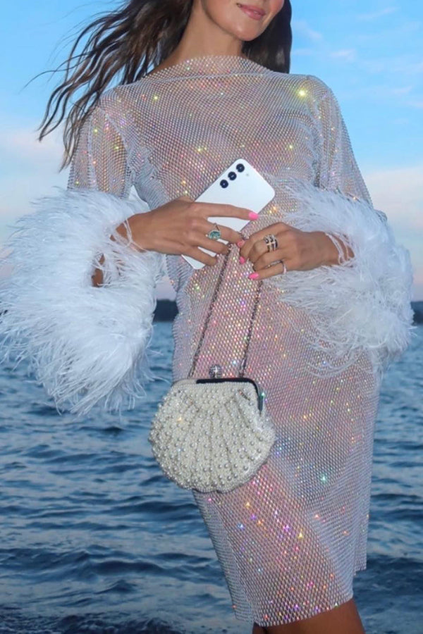 Minivestido de fiesta Sorpresa Nocturna de tejido con strass y mangas de plumas
