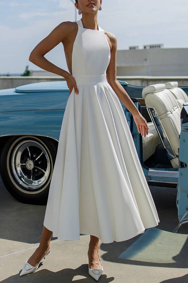 Vestido midi elegante de color liso con cuello halter, lazo y cintura ceñida