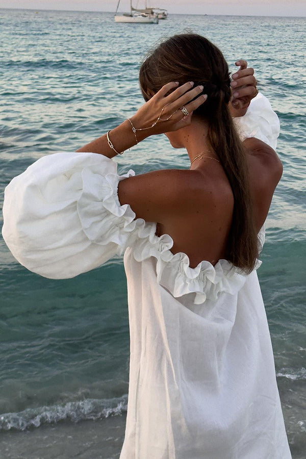Vestido midi Francisca en mezcla de lino con hombros descubiertos, volantes, manga abullonada y bolsillos